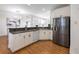 Modern kitchen featuring stainless steel appliances and white cabinetry at 2750 Olde Towne Pkwy, Duluth, GA 30097
