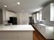Bright, updated kitchen boasts white cabinets, sleek countertops, and stainless steel appliances at 2750 Olde Towne Pkwy, Duluth, GA 30097