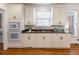Kitchen with white cabinets, granite countertops, and gas cooktop at 2750 Olde Towne Pkwy, Duluth, GA 30097