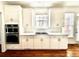 Modern kitchen with bright white cabinetry, stainless steel appliances, and subway tile backsplash at 2750 Olde Towne Pkwy, Duluth, GA 30097
