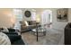 Bright living room with comfy seating, a fireplace, and large windows at 2750 Olde Towne Pkwy, Duluth, GA 30097