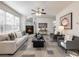 Open living room with a fireplace and plenty of natural light at 2750 Olde Towne Pkwy, Duluth, GA 30097