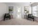 Bright sitting area with two armchairs and a view of the ensuite bathroom at 2750 Olde Towne Pkwy, Duluth, GA 30097