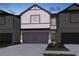 Charming two-story home with a two-car garage and landscaped front yard at 2113 Avalon Rdg, Conyers, GA 30013