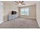 Spacious bedroom with ceiling fan and large window at 3317 Steeple Chase Way, Conyers, GA 30094