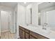 Bright bathroom featuring double sinks, modern fixtures, and a large mirror at 2024 Avalon Rdg, Conyers, GA 30013