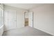 Bedroom with carpet, neutral walls and a view into the hallway at 2024 Avalon Rdg, Conyers, GA 30013