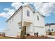 Two-story home with white siding, a two-car garage, and a manicured front lawn at 2024 Avalon Rdg, Conyers, GA 30013