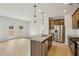 Open kitchen with stainless steel appliances, granite countertops, and an island with a sink at 2024 Avalon Rdg, Conyers, GA 30013