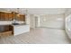 Open-concept living space with a modern kitchen and sleek flooring, perfect for entertaining at 2024 Avalon Rdg, Conyers, GA 30013