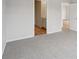 Bedroom featuring neutral carpeting with an adjoining bathroom and doorways at 2026 Avalon Rdg, Conyers, GA 30013