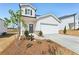 Inviting two-story home with a manicured front yard and a spacious two-car garage at 2026 Avalon Rdg, Conyers, GA 30013
