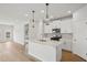 Modern kitchen with stainless steel appliances, white cabinets, and a large center island at 2026 Avalon Rdg, Conyers, GA 30013