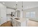 Contemporary kitchen featuring stainless steel appliances, white cabinets, and ample counter space at 2026 Avalon Rdg, Conyers, GA 30013