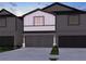 Charming two-story home with a spacious two-car garage and attractive exterior at 2115 Avalon Rdg, Conyers, GA 30013