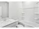 A bathroom with one sink and a white toilet next to the bathtub and shower with a white surround at 2028 Avalon Rdg, Conyers, GA 30013