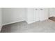 Small bedroom with carpet and small window and a corner with two doors at 2028 Avalon Rdg, Conyers, GA 30013