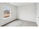 Bedroom with gray carpet, a window, neutral walls and natural light at 2028 Avalon Rdg, Conyers, GA 30013