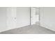 Bedroom features neutral walls, grey carpet and a hallway view at 2028 Avalon Rdg, Conyers, GA 30013