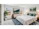 Bright bedroom with a large bed, stylish furnishings, and ample natural light from the windows at 2028 Avalon Rdg, Conyers, GA 30013