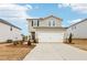Charming two-story home featuring a two-car garage and a well-manicured lawn in a modern community at 2028 Avalon Rdg, Conyers, GA 30013
