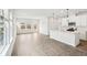 Bright, open-concept kitchen featuring stainless steel appliances, an island, and natural light at 2028 Avalon Rdg, Conyers, GA 30013