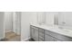 Modern bathroom featuring double sink vanity with neutral countertop at 2032 Avalon Rdg, Conyers, GA 30013
