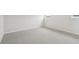 This empty bedroom features neutral carpet, white walls, and bright natural light at 2032 Avalon Rdg, Conyers, GA 30013