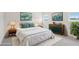 Bright staged bedroom offers decor, area rug, and coordinating wall art. (Virtually Staged) at 2032 Avalon Rdg, Conyers, GA 30013