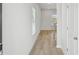 Spacious foyer featuring light walls, a window, light wood flooring and a coat closet at 2032 Avalon Rdg, Conyers, GA 30013