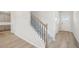 Foyer with light walls, wood flooring, view of the stairs to the second floor and kitchen at 2032 Avalon Rdg, Conyers, GA 30013