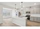 Stylish kitchen with stainless appliances, island, and modern pendant lighting at 2032 Avalon Rdg, Conyers, GA 30013