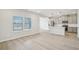 Open kitchen with a kitchen island, stainless steel appliances, and hardwood floors at 2032 Avalon Rdg, Conyers, GA 30013