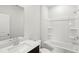 A bathroom with a white double vanity, white toilet and white bathtub at 2036 Avalon Rdg, Conyers, GA 30013