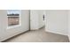 Bright bedroom with carpet, white walls and doors, and natural light at 2036 Avalon Rdg, Conyers, GA 30013