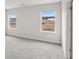 Bright bedroom with a large window offering natural light and neutral carpet at 2036 Avalon Rdg, Conyers, GA 30013