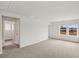 A bonus room with gray carpet, white walls and two windows at 2036 Avalon Rdg, Conyers, GA 30013