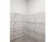 A closet with white shelving and white walls at 2036 Avalon Rdg, Conyers, GA 30013