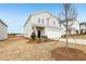 Charming two-story home with light gray siding, a two-car garage, and minimal front yard landscaping at 2036 Avalon Rdg, Conyers, GA 30013