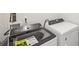 A laundry room with a modern washing machine and dryer at 2036 Avalon Rdg, Conyers, GA 30013