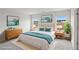 Beautifully staged bedroom featuring tasteful decor, two windows, and neutral carpet at 2036 Avalon Rdg, Conyers, GA 30013