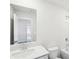 Bright bathroom featuring a single sink vanity, mirror, a shower and tub at 2038 Avalon Rdg, Conyers, GA 30013