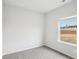 Bright bedroom with plush carpeting, natural light, and a window view of the surrounding landscape at 2038 Avalon Rdg, Conyers, GA 30013