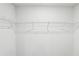 Empty walk in closet featuring basic wire shelf organizers against white walls and a blank canvas at 2038 Avalon Rdg, Conyers, GA 30013