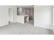 Hallway with grey carpet, white walls, white door frames and a dark wood banister at 2038 Avalon Rdg, Conyers, GA 30013