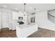 Modern kitchen features stainless steel appliances, white cabinets, and center island at 2038 Avalon Rdg, Conyers, GA 30013
