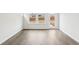 Open-concept space featuring hardwood floors and a door to the backyard at 2038 Avalon Rdg, Conyers, GA 30013