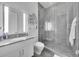 Modern bathroom with a walk-in shower and gray tile at 1301 Peachtree # 3B, Atlanta, GA 30309