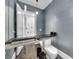 Modern powder room with floating vanity and unique textured walls at 1301 Peachtree # 3B, Atlanta, GA 30309