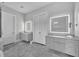 Modern bathroom with double vanities and a large mirror at 1301 Peachtree # 3B, Atlanta, GA 30309